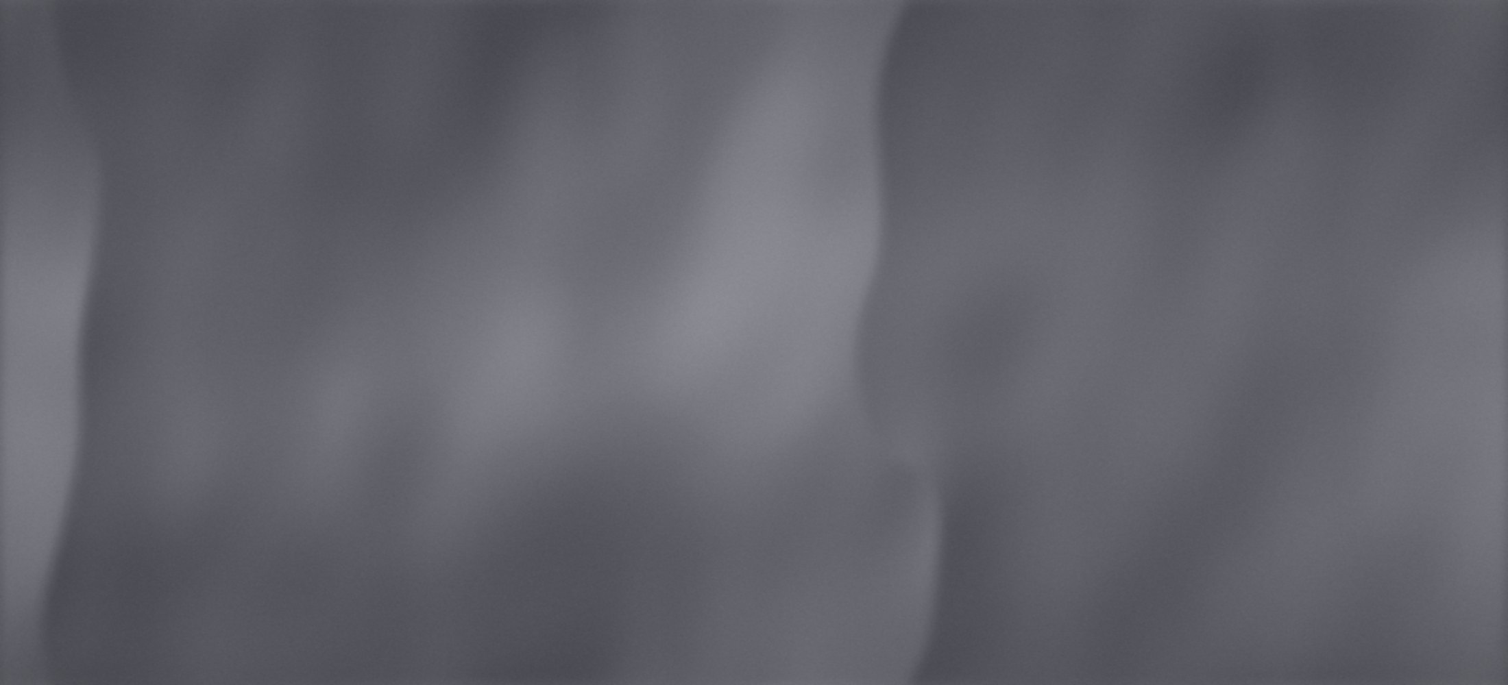How to have anal sex without it hurting: soft folds of a grey bed sheet