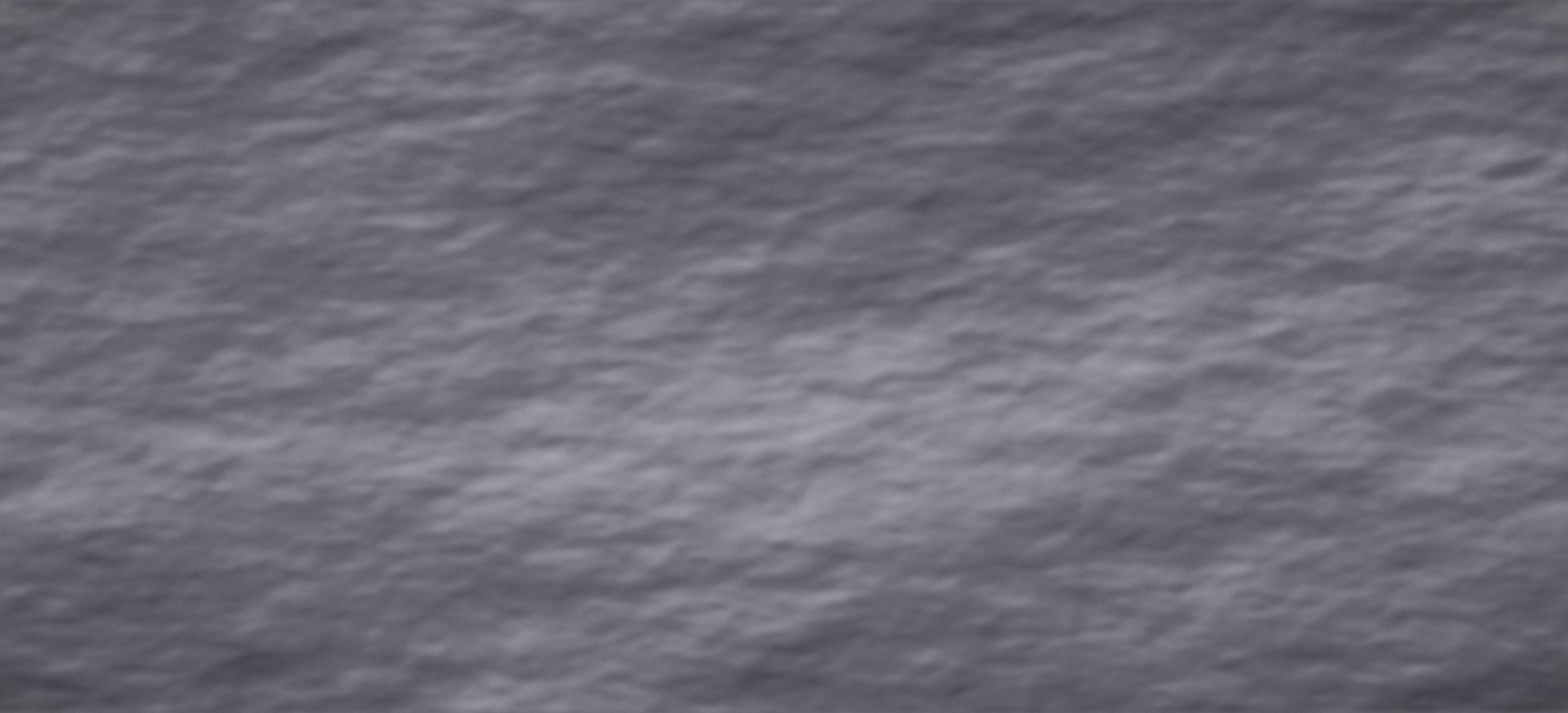 How to tell him what I want in bed: close-up of rumpled grey bed linen